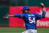 Texas Rangers pitcher José Ureña throws to an Oakland Athletics batter during the first...