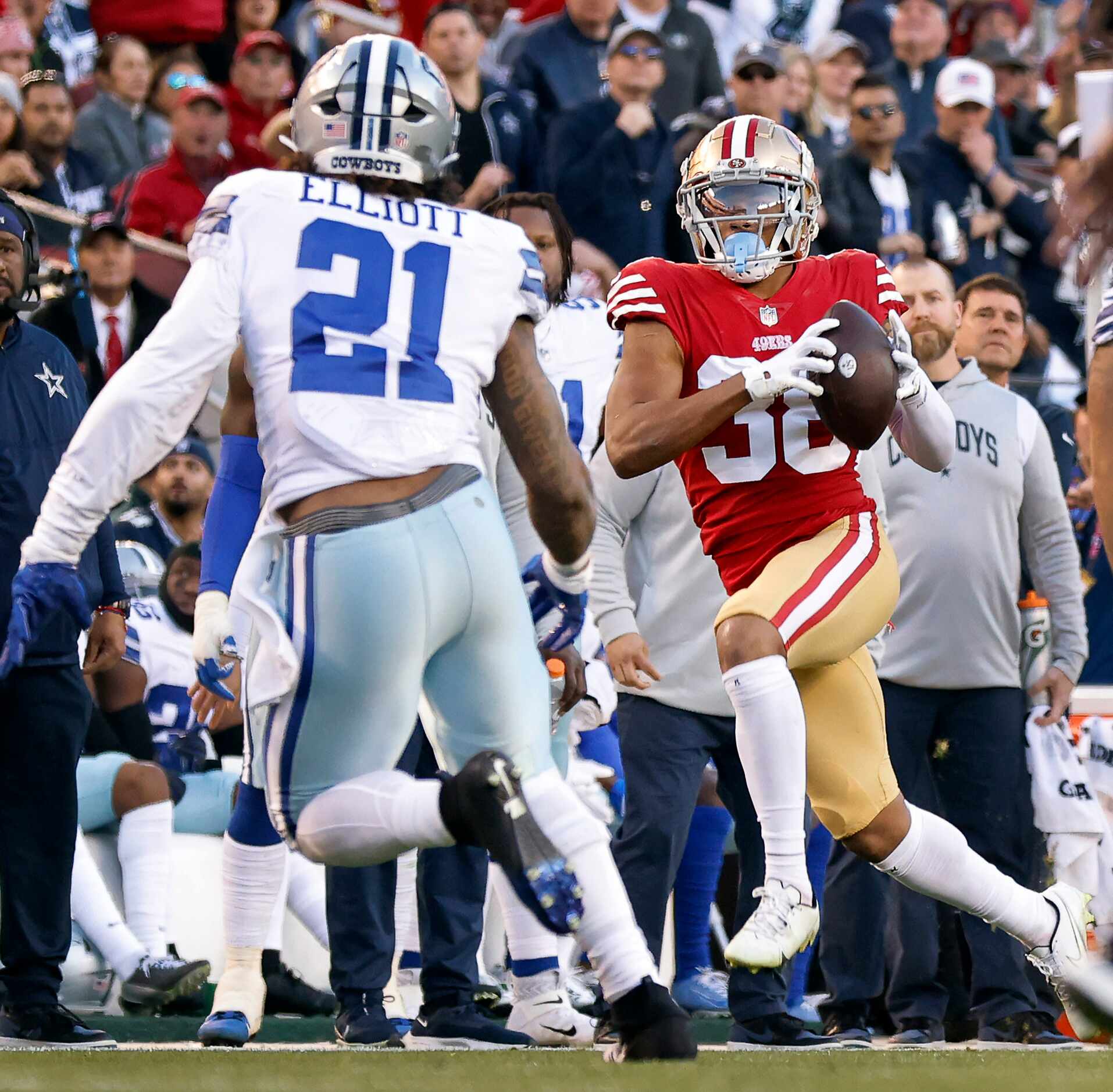Dallas Cowboys running back Ezekiel Elliott (21) looks to tackle San Francisco 49ers...
