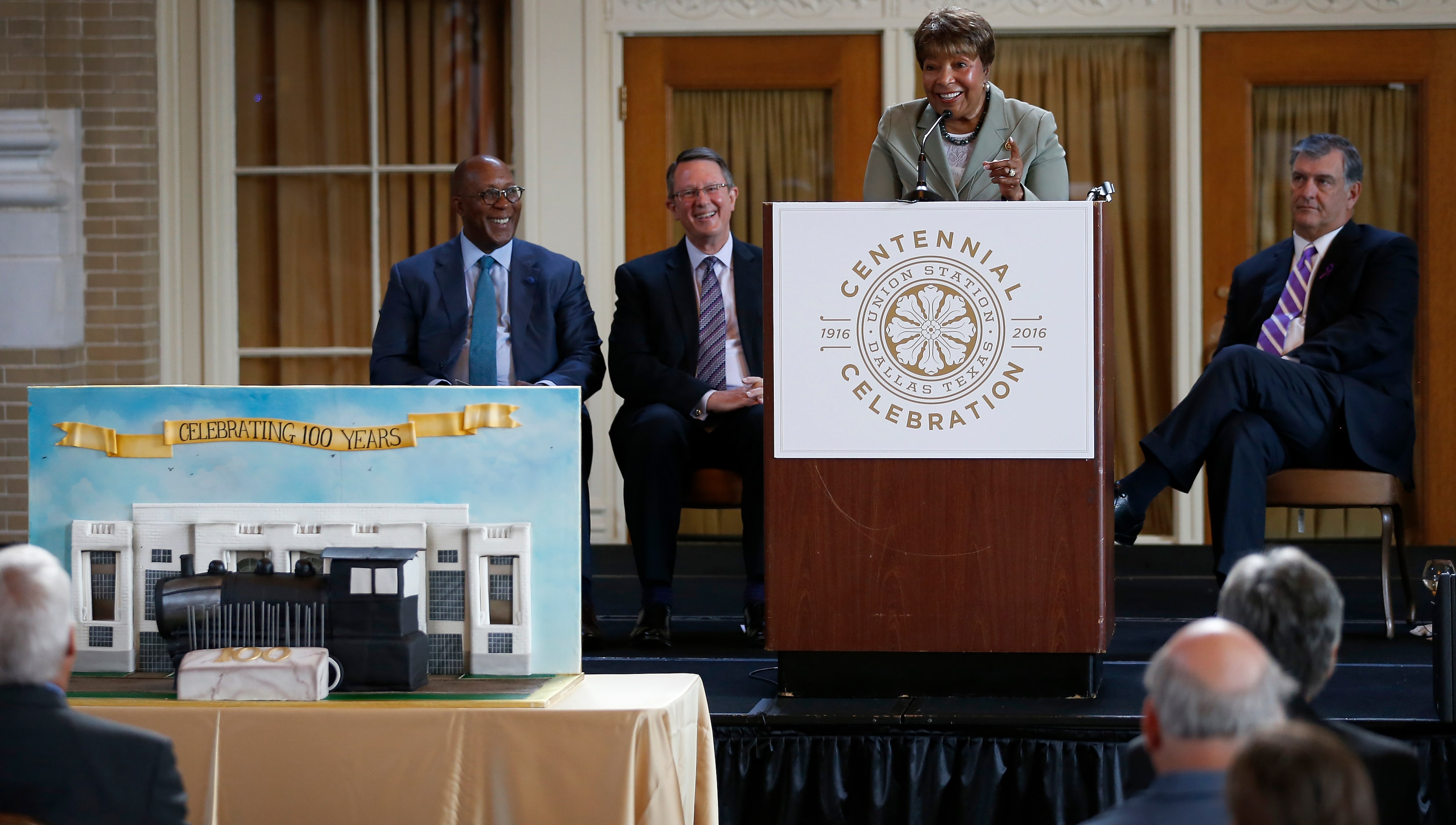 Congresswoman Eddie Bernice Johnson speaks next to Mayor Mike Rawlings (right), Ambassador...