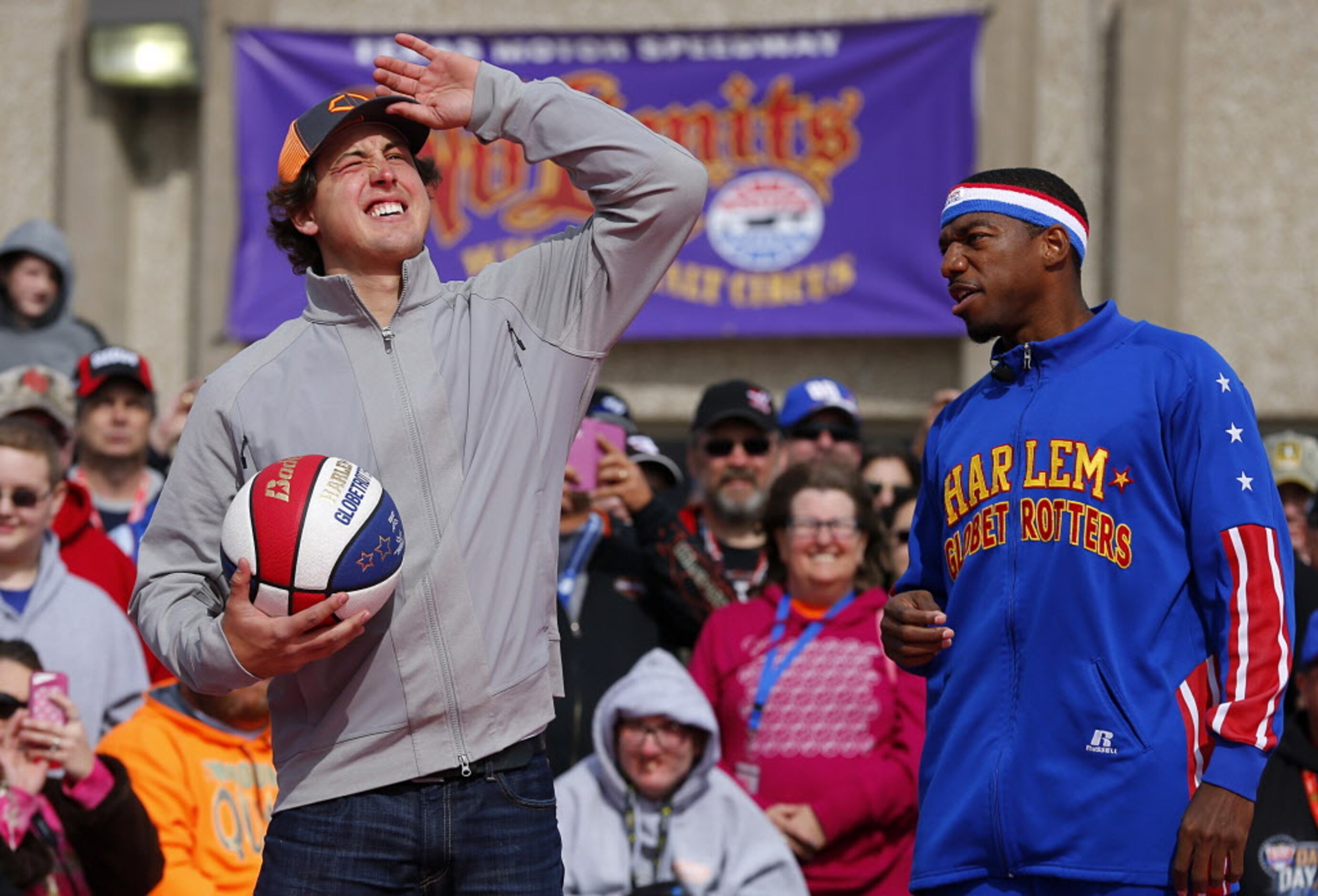 Texas Rangers pitcher Derek Holland shoots hoops with the Harlem Globetrotters during the No...