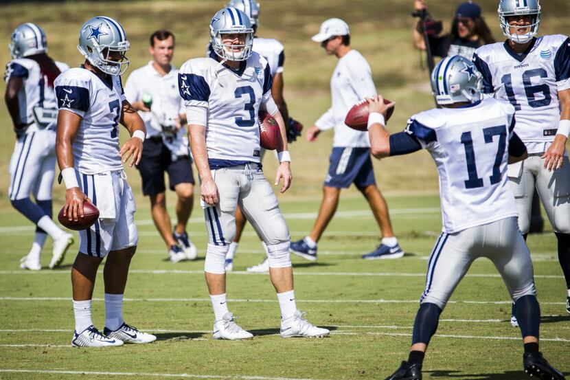 Dallas Cowboys practice squad quarterback Jameill Showers (7), left, and Dallas Cowboys...