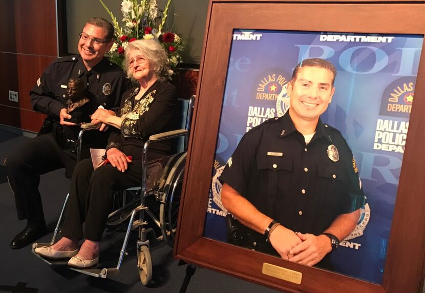 Det. Edmundo Lujan poses with his mother-in-law, Raquel Hinojos, at a ceremony at the Dallas...