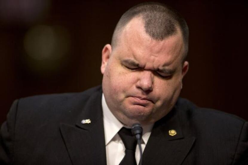 
Brian Lewis, former Petty Officer Third Class, U.S. Navy, paused as he testified on Capitol...