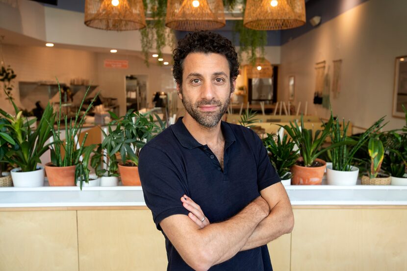 Jon Alexis, owner of TJ's Fresh Seafood and Malibu Poke, poses for a portrait inside one of...