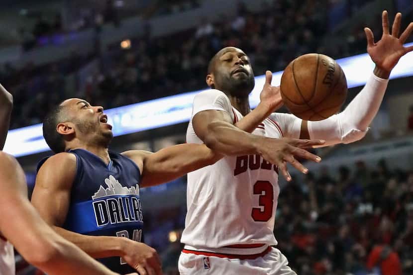 CHICAGO, IL - JANUARY 17: Dwyane Wade #3 of the Chicago Bulls knocks the ball away from...
