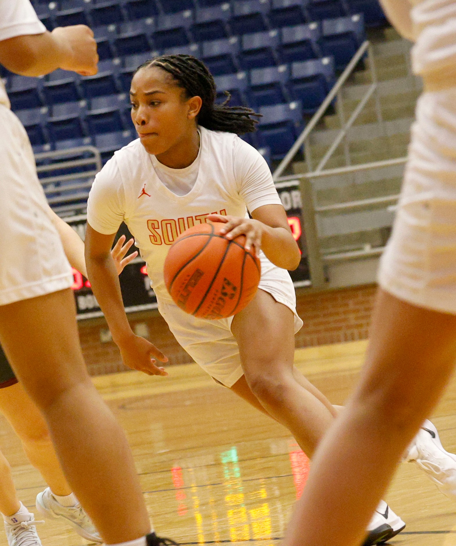 South Grand Prairie's Camille Mitchell (4) dribbles during the second half of a high school...