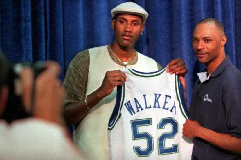 6/27/96--Dallas first-round draft pick  Samaki (cq) Walker poses for a photo with his new...