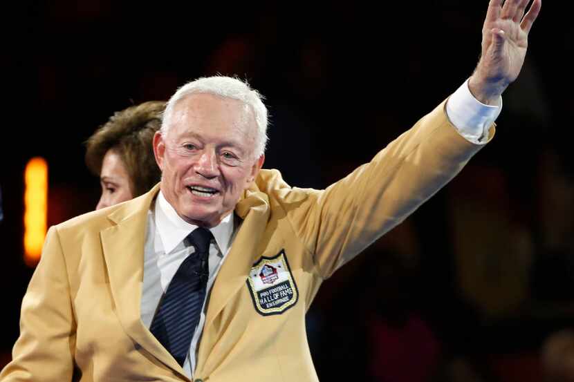 Dallas Cowboys owner and general manager Jerry Jones waves to the crowd after his wife Gene...
