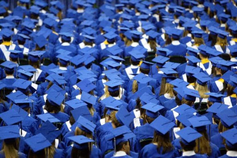 Students are pictured at a Plano West Senior High School graduation ceremony. The Plano ISD...