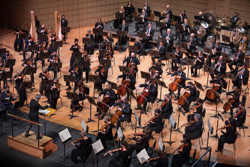 Dallas Symphony Orchestra music director Fabio Luisi, bottom-left, conducts members of the...