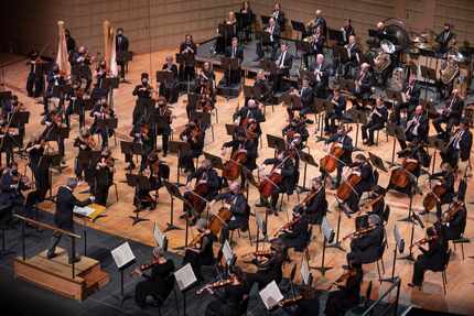 Dallas Symphony Orchestra music director Fabio Luisi, bottom left, conducts members of the...