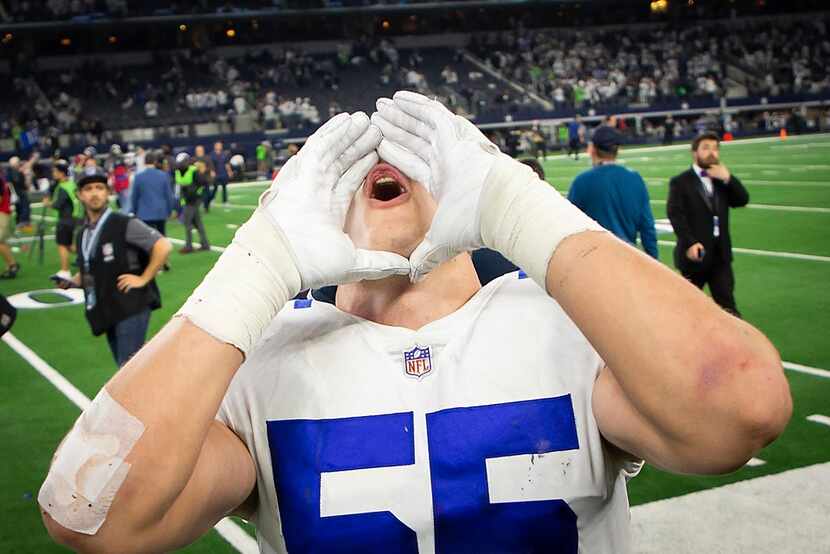 Dallas Cowboys outside linebacker Leighton Vander Esch celebrates as he leaves the field...