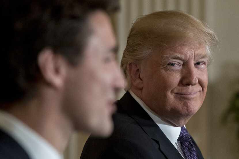President Donald Trump smiles at Justin Trudeau, Canada's prime minister, during a news...