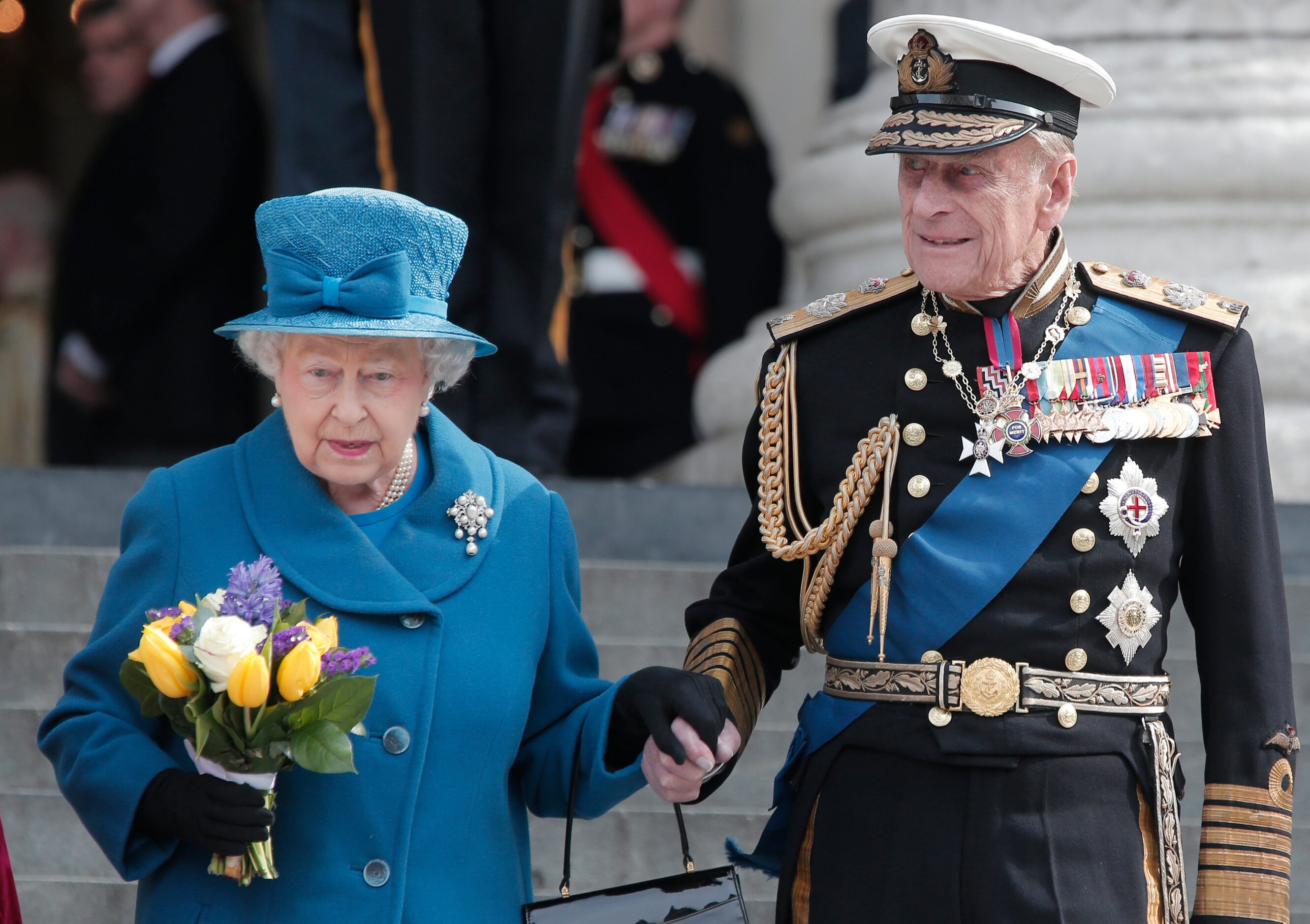 Britain's Queen Elizabeth II, accompanied by Prince Philip, leaves after attending a service...