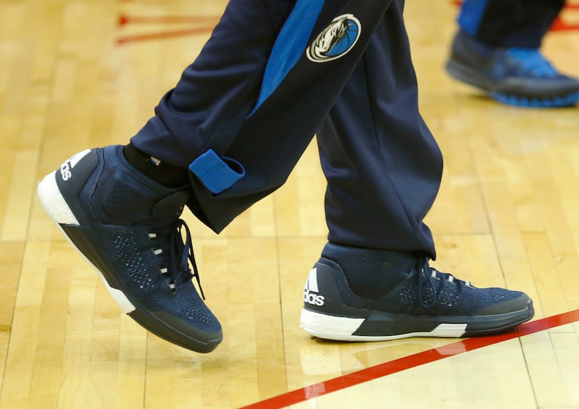 Mavericks guard Devin Harris feet during warmups. Harris is wearing two different sized...