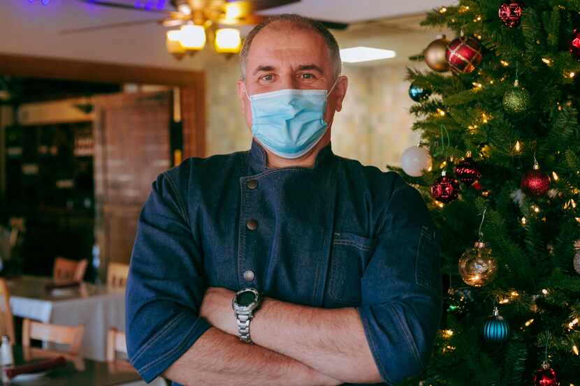 Artur Pira, owner of Aboca's Italian Grill, stands in Aboca's dining room on December 10,...