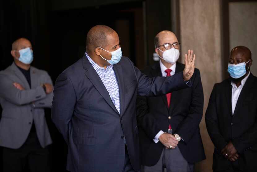 Mayor Eric Johnson waves to members of his Anti-Hate Advisory Council on Wednesday, Sept....