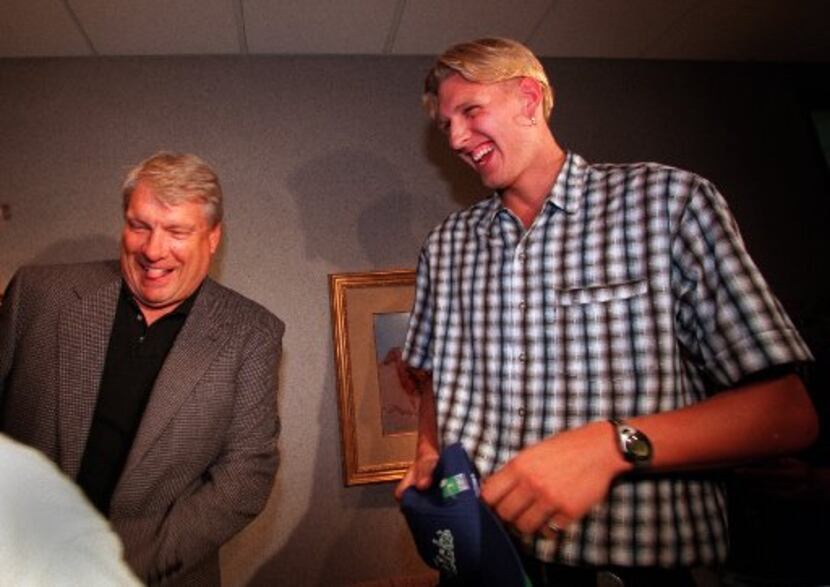 FILE - Dirk Nowitzki, right, takes in a laugh with  Mavericks head coach Don Nelson, left,...