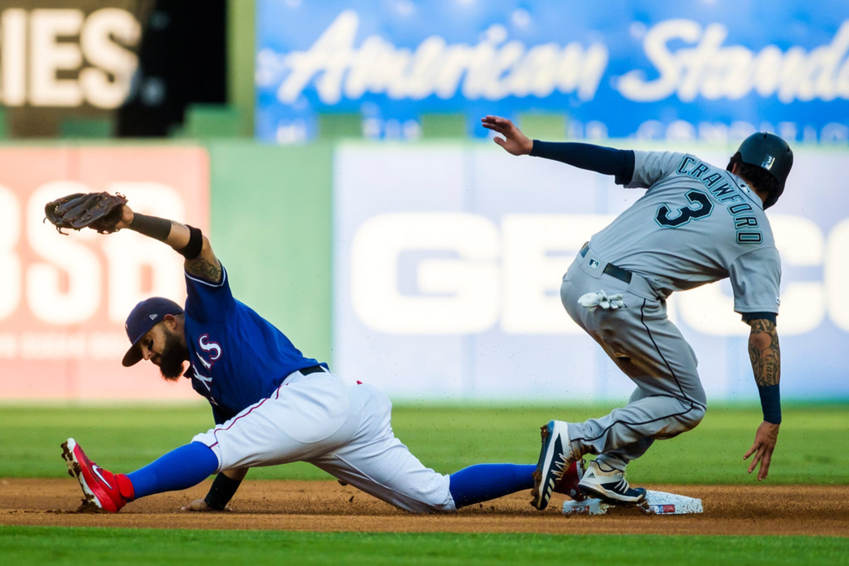 Seattle Mariners shortstop J.P. Crawford (3) is out as second base as Texas Rangers second...