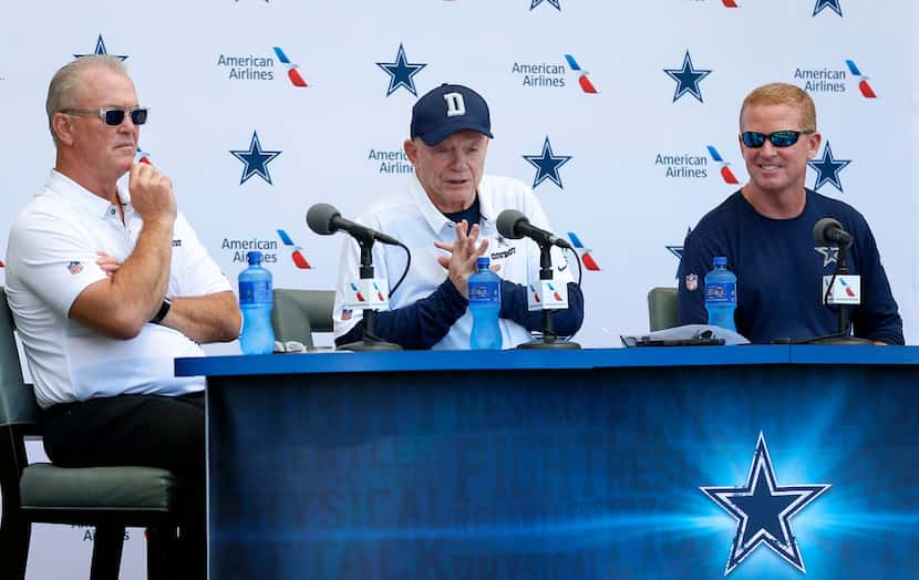 Cowboys owner Jerry Jones, center, speaks as head coach Jason Garrett, right, and executive...