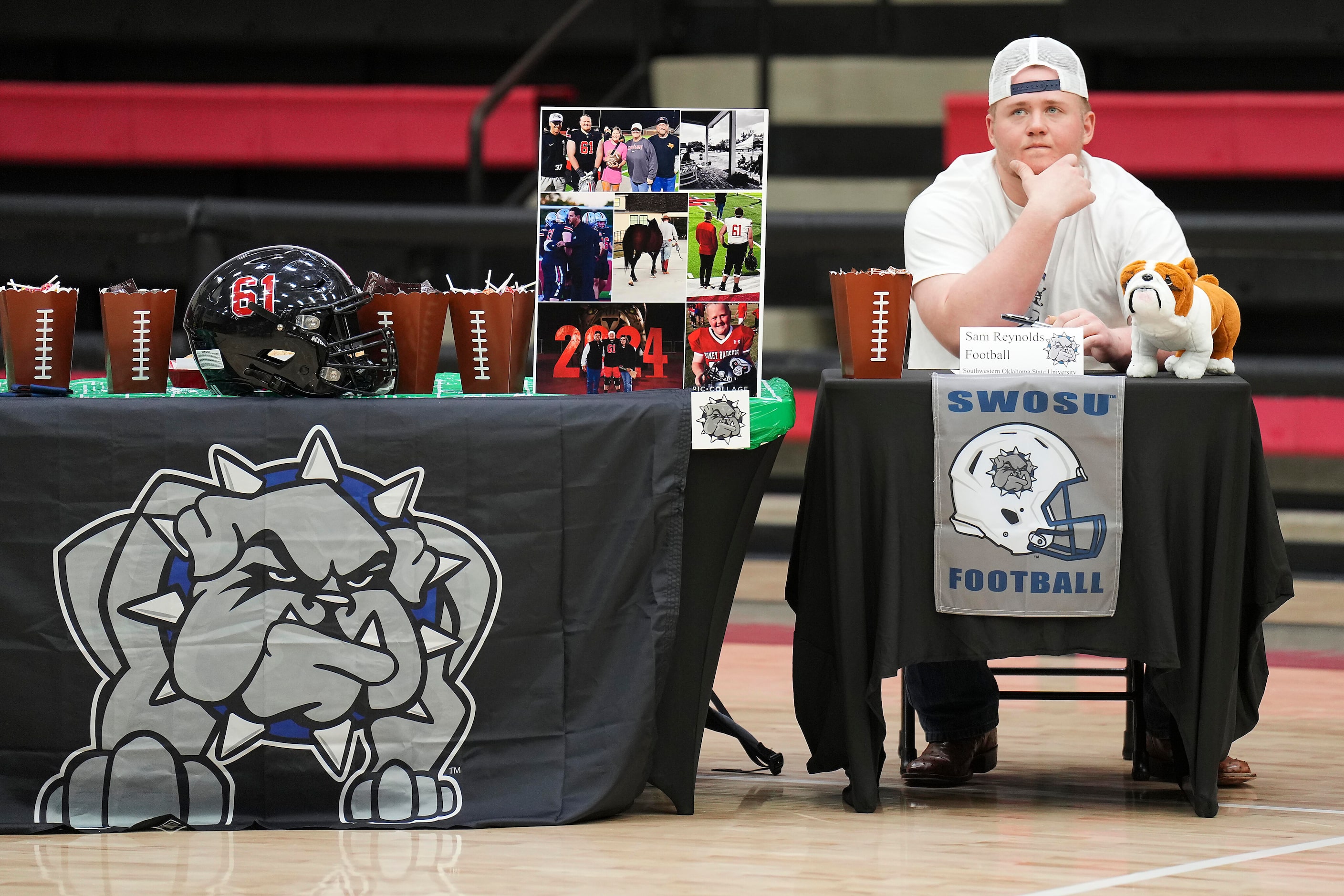 Lovejoy all-state offensive lineman Sam Reynolds looks out over the gymnasium during a...