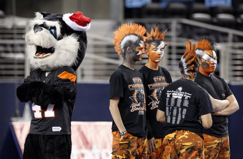 Aledo flag runners (right) and the team mascot (left) await the team to take the field...
