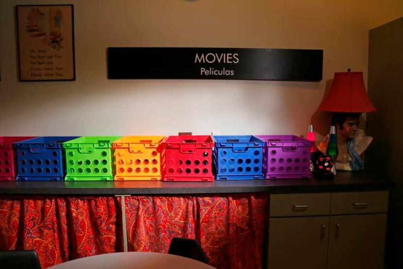 
Colorful boxes hold the movie library’s collection and returns.
