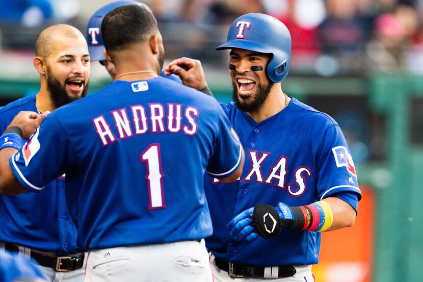 CLEVELAND, OH - JUNE 27: Elvis Andrus #1 celebrates with Robinson Chirinos #61 of the Texas...