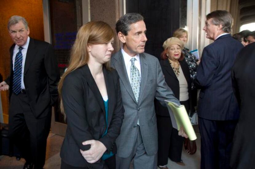 
Abigail Fisher and her attorney, Edward Blum, walked past University of Texas President...