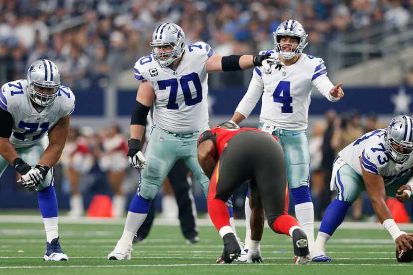 Dallas Cowboys offensive guard Zack Martin (70) points out a player before the snap as he...