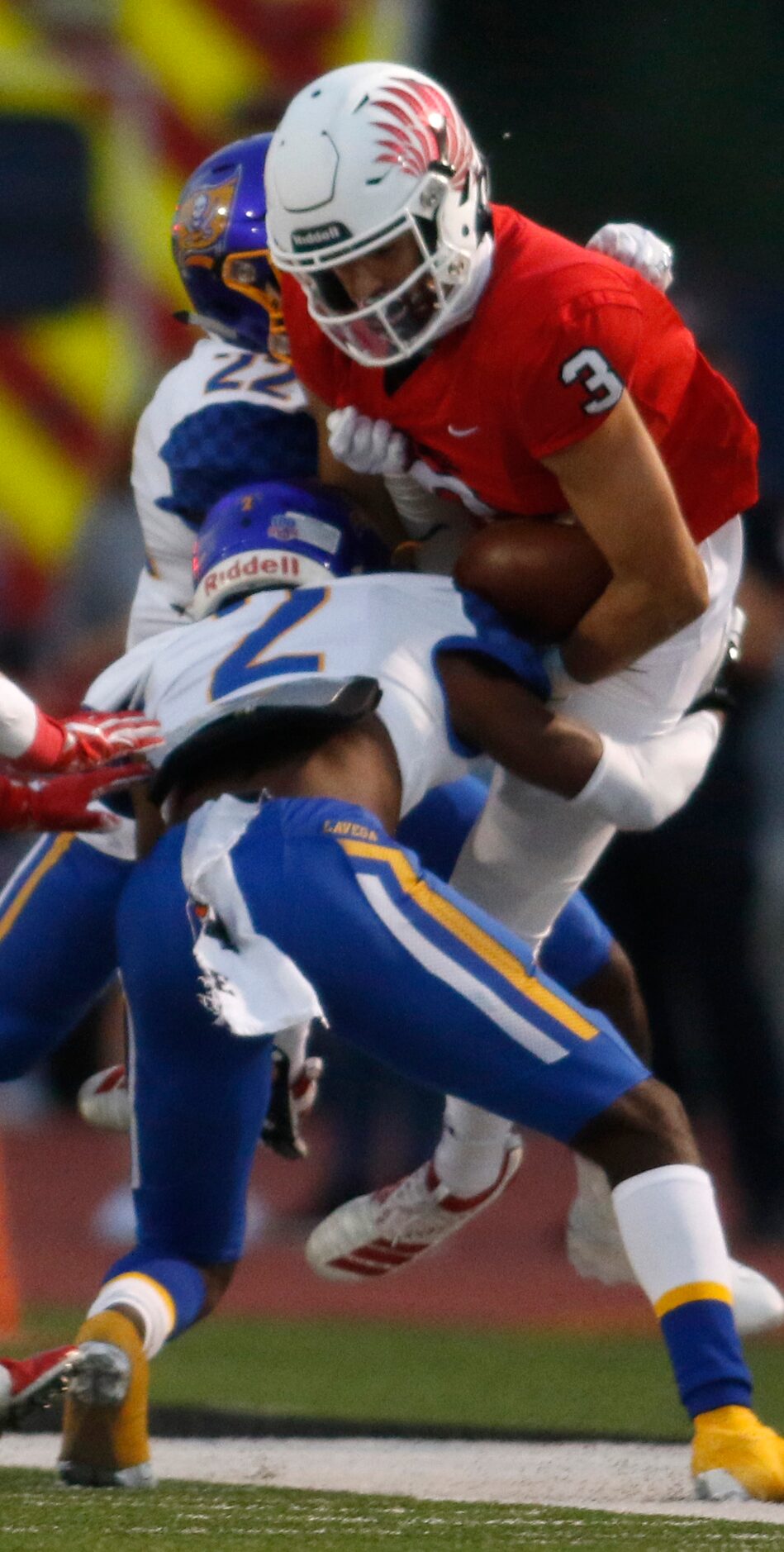 Argyle receiver Cash Walker (3) is stopped by Waco LaVega defensive backs Marcus Willis (2)...