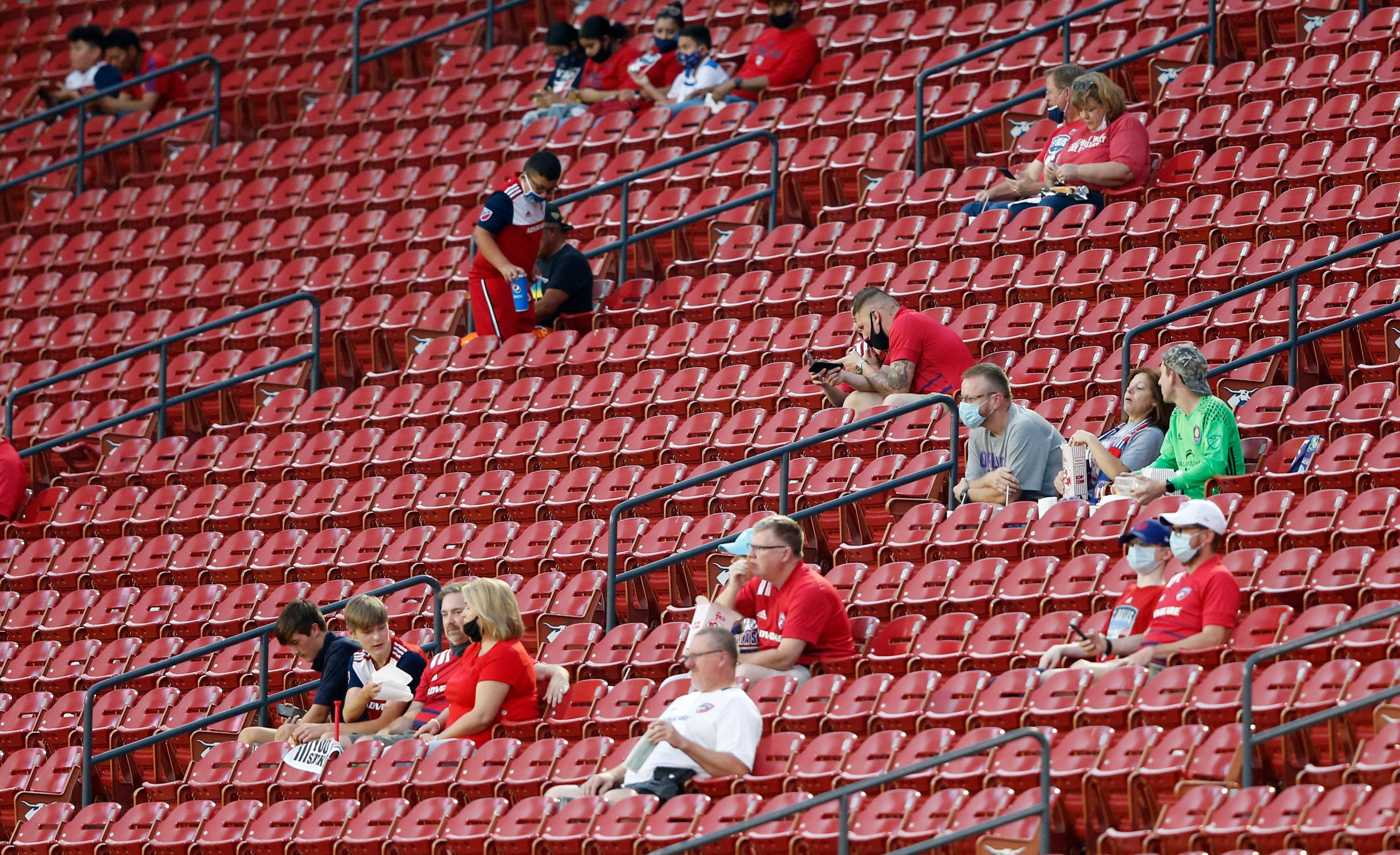 FC Dallas fans make their way to their seat before a game against the Orlando City at Toyota...