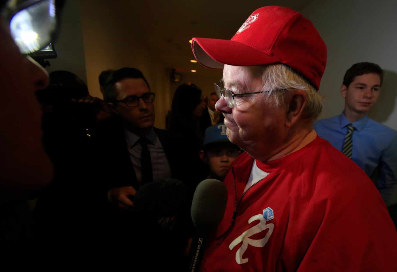 Rep. Joe Barton, R-Arlington, manager of the Republican team, wearing his baseball uniform,...