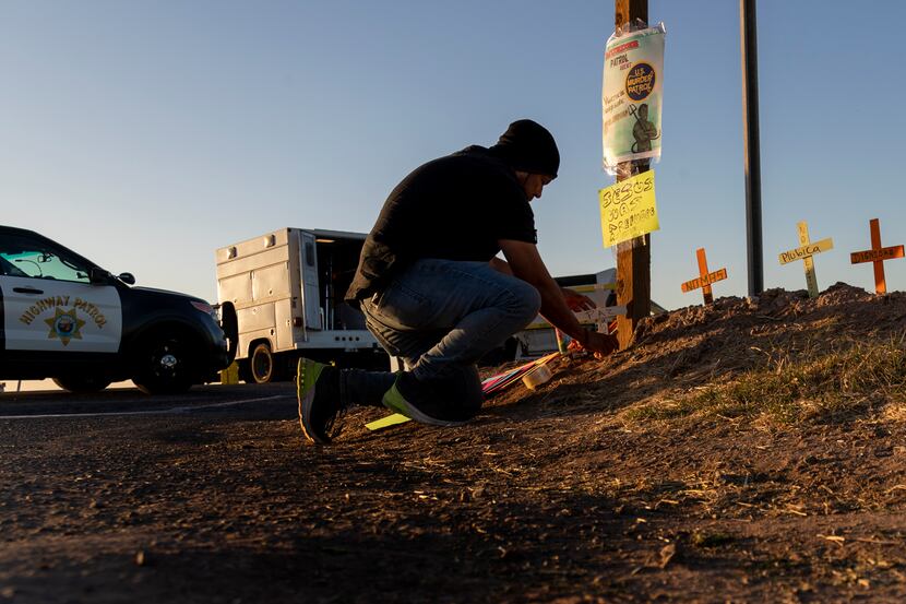 Hugo Chavez, an activist with the Coalition for Human Immigration Rights, placed crosses at...