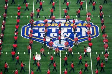 The Cincinnati band performs before the Cotton Bowl NCAA college football playoff semifinal...
