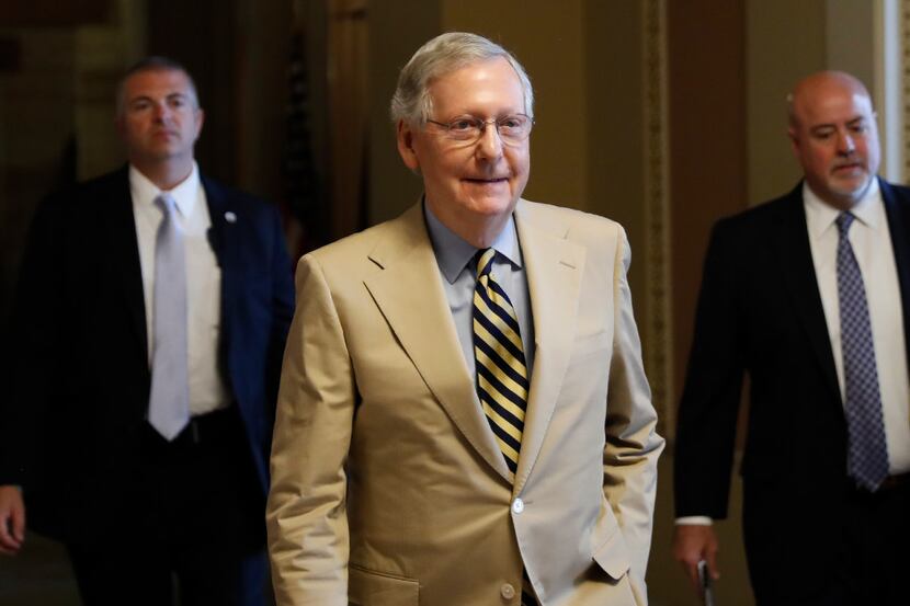 Senate Majority Leader Mitch McConnell of Ky. walks from his office on Capitol Hill in...