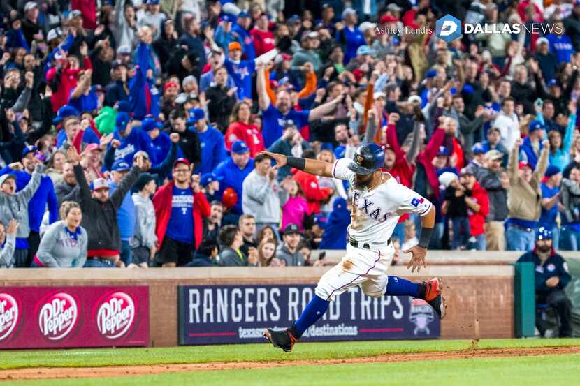 Texas Rangers second baseman Rougned Odor (12) runs towards home for the winning run in a...