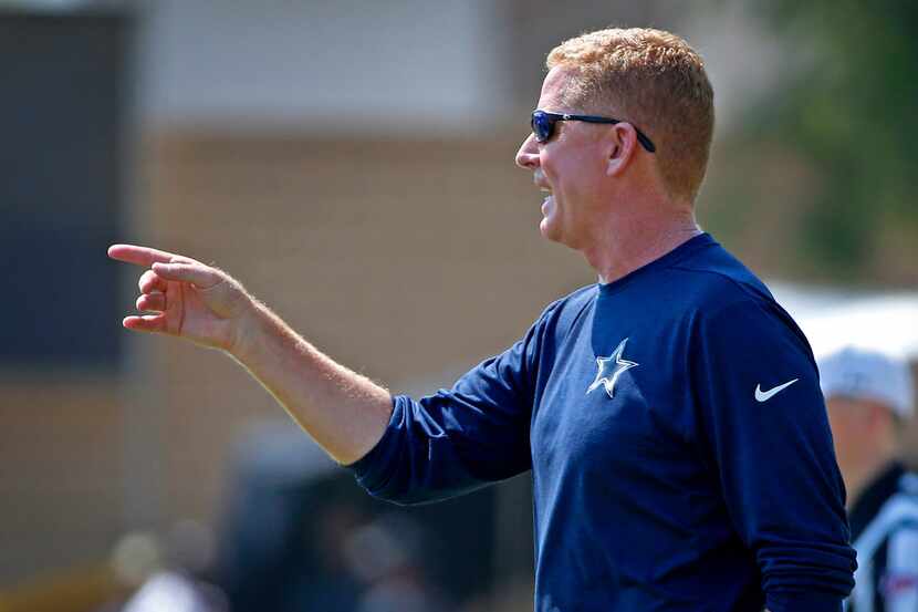 Dallas Cowboys head coach Jason Garrett directs his team during the morning practice at the...