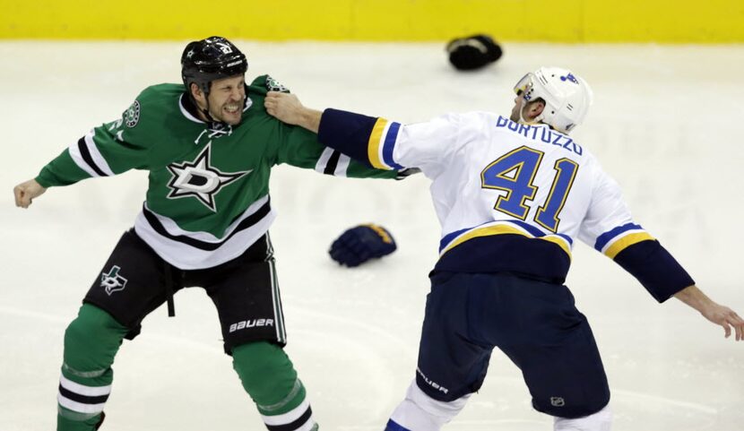 Dallas Stars left wing Travis Moen, left, and St. Louis Blues defenseman Robert Bortuzzo,...