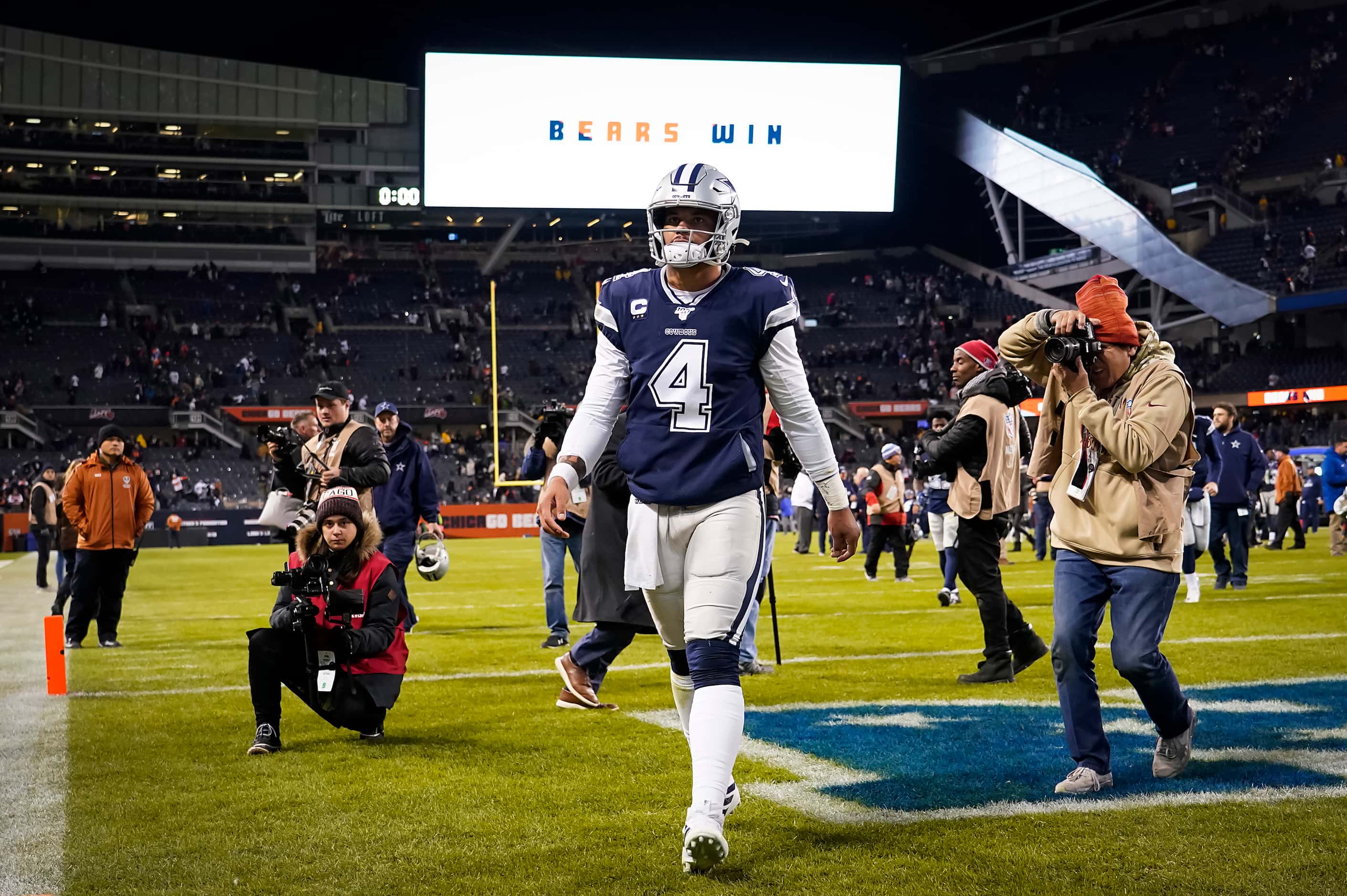 Dallas Cowboys quarterback Dak Prescott walks off the field after a loss to the Chicago...