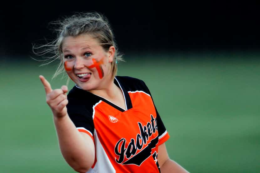 Rockwall first baseman  Elizabeth Schaefer (21) gestures to a teammate after making a...