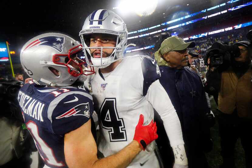 Dallas Cowboys quarterback Dak Prescott (4) congratulated New England Patriots wide receiver...