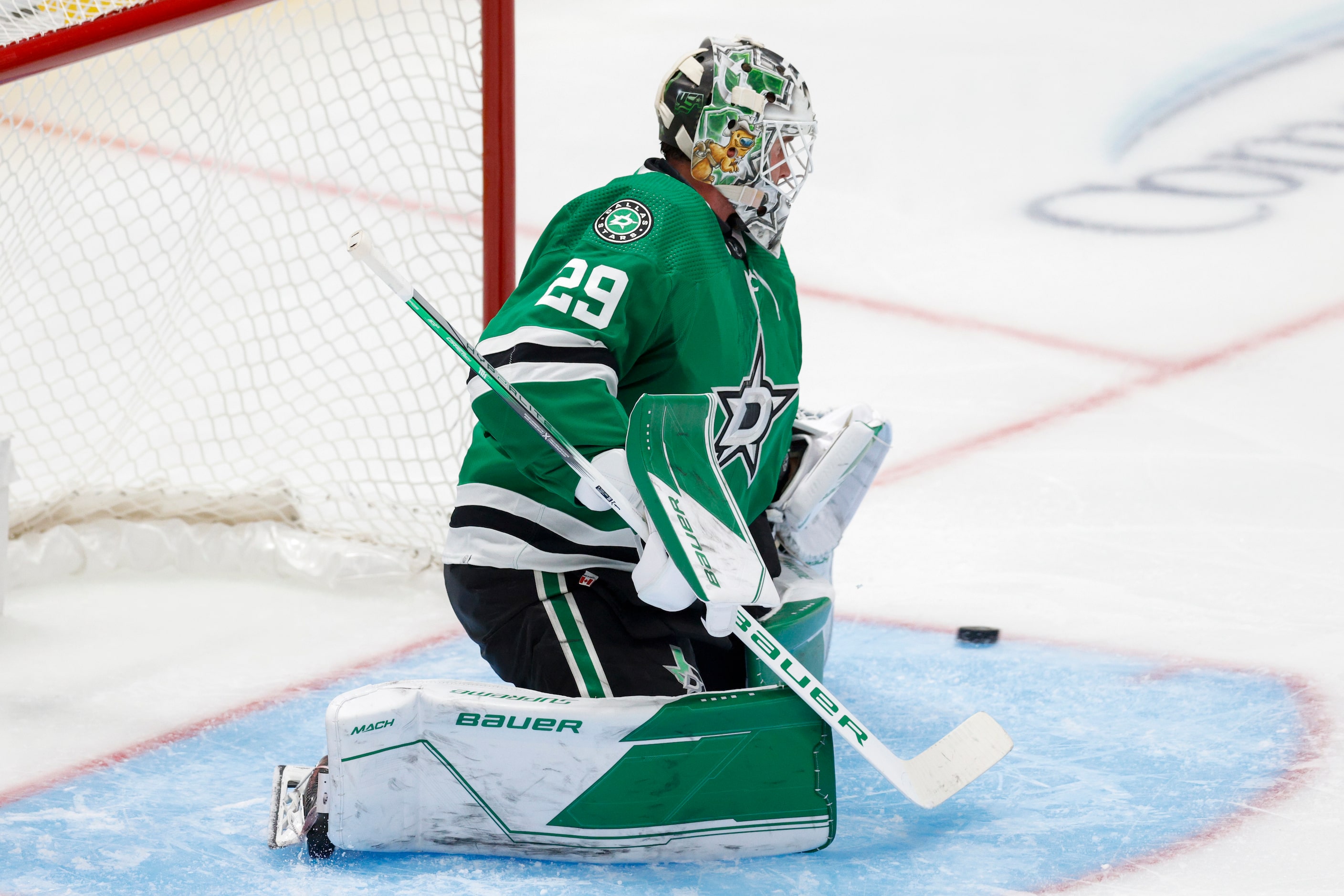 Dallas Stars goaltender Jake Oettinger (29) watches as a shot sails wide of the goal during...