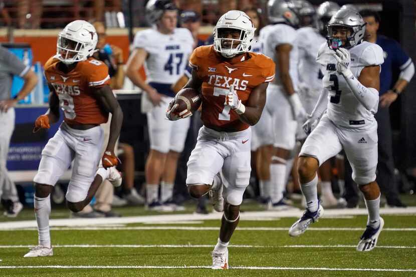 Texas running back Keilan Robinson (7) runs for a long touchdown against Rice during the...