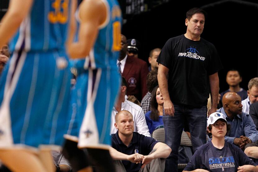 Dallas Mavericks owner Mark Cuban dejected after a made basket from the New Orleans Hornets...