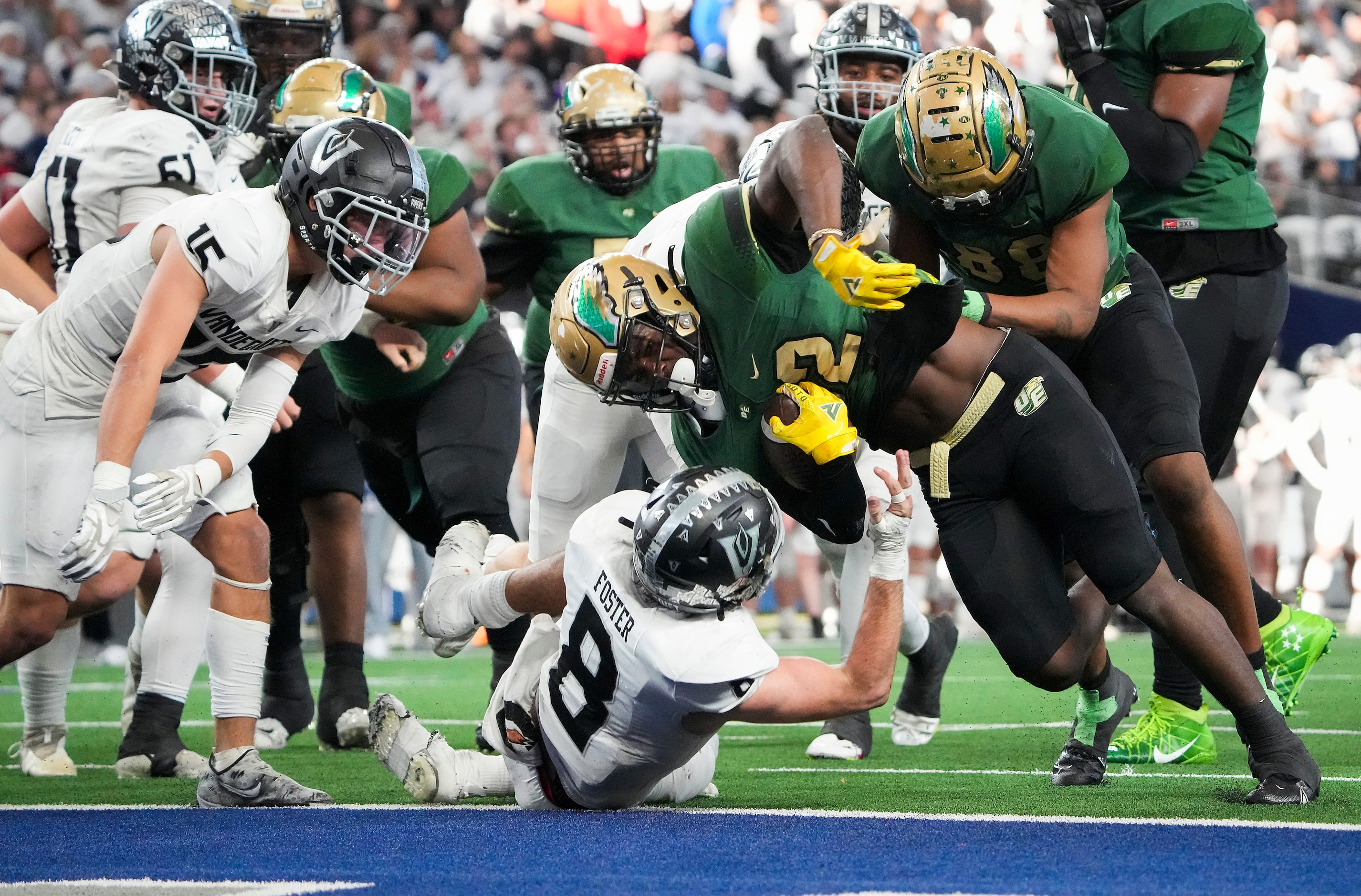 DeSoto running back Deondrae Riden (22) pushes past Austin Vandegrift defensive back Alex...