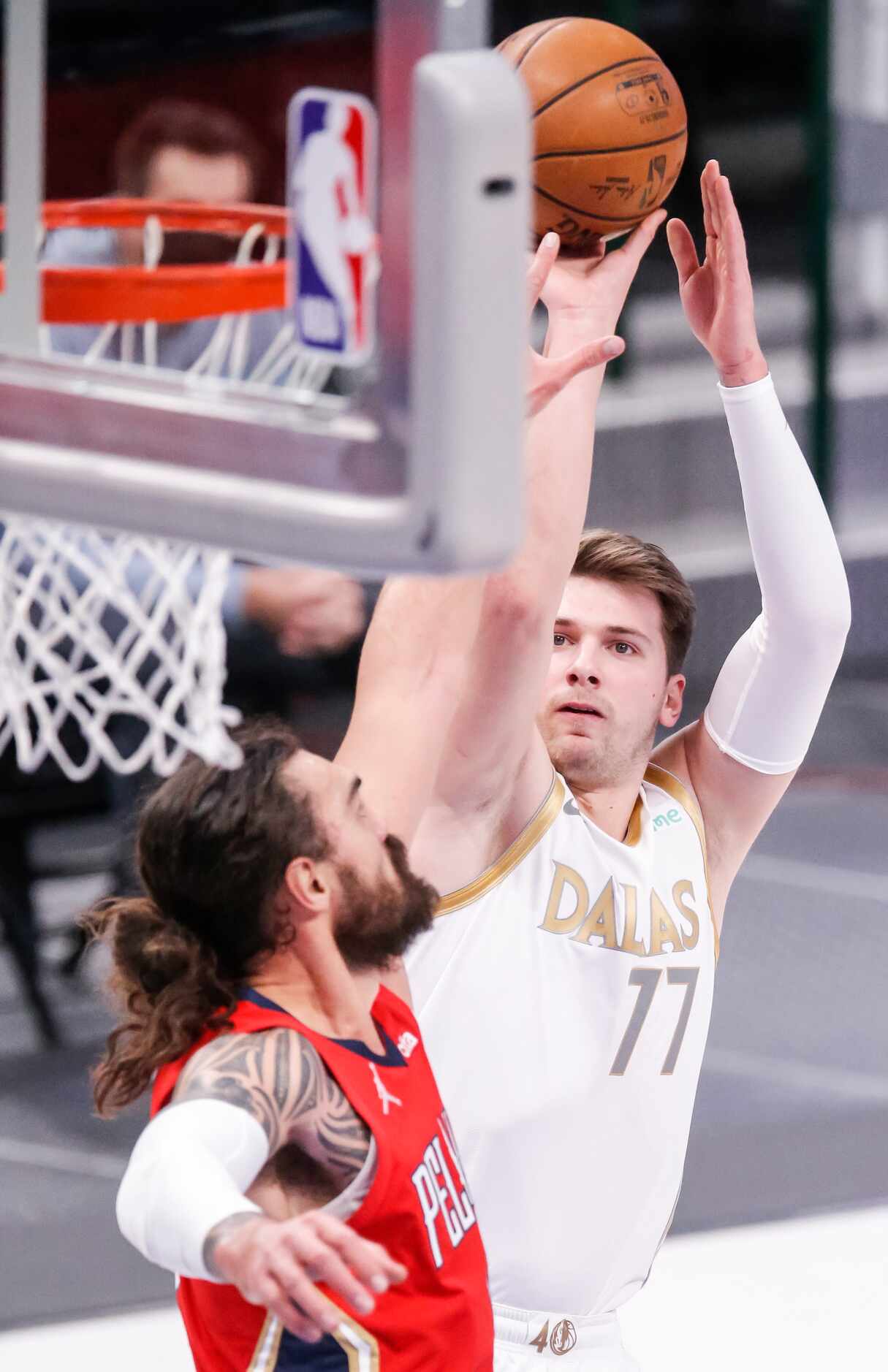 Dallas Mavericks guard Luka Doncic (77) attempts a shot as New Orleans Pelicans forward...
