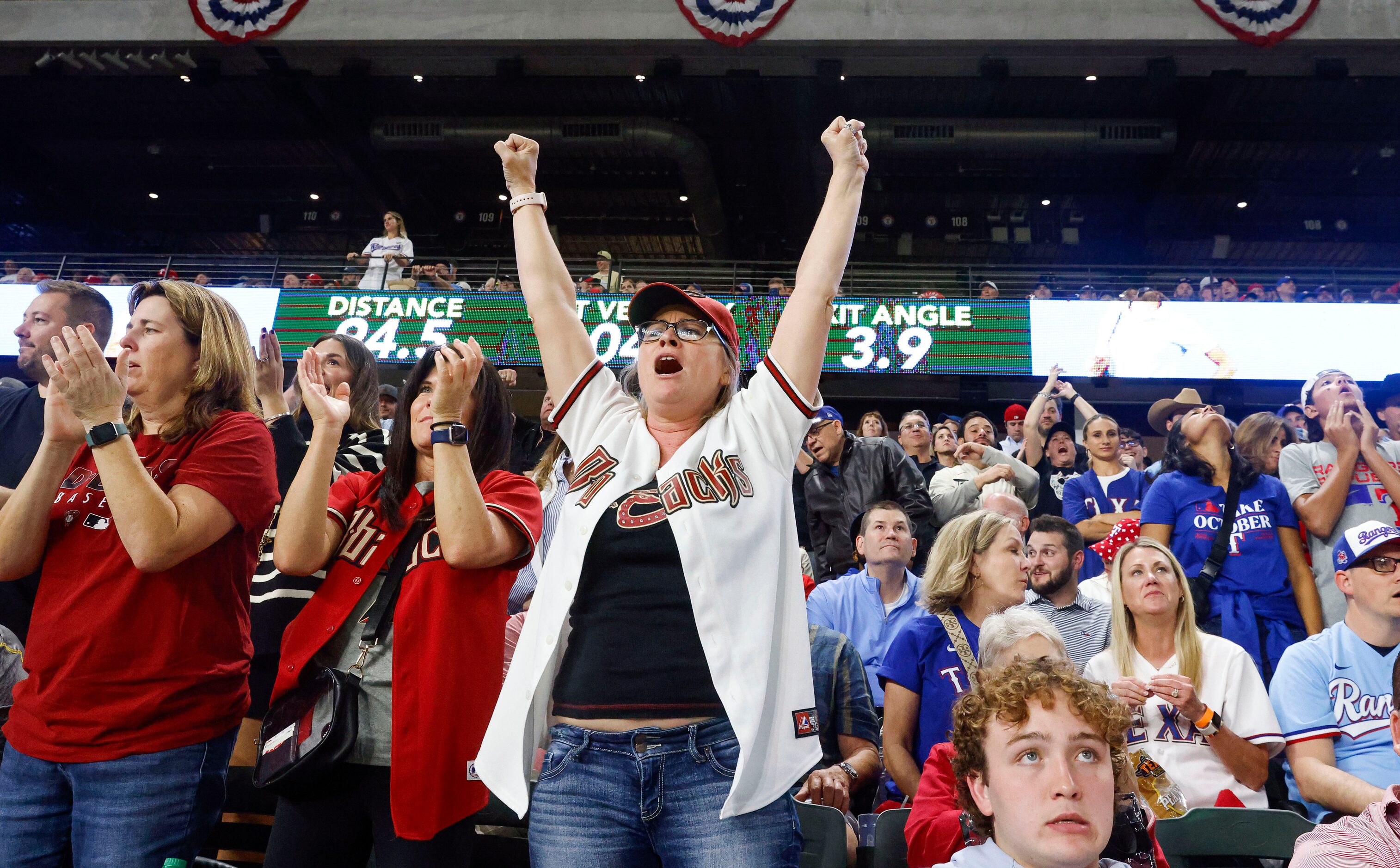 Arizona Diamondbacks fans react to Corbin Carroll’s single against Texas Rangers in the...