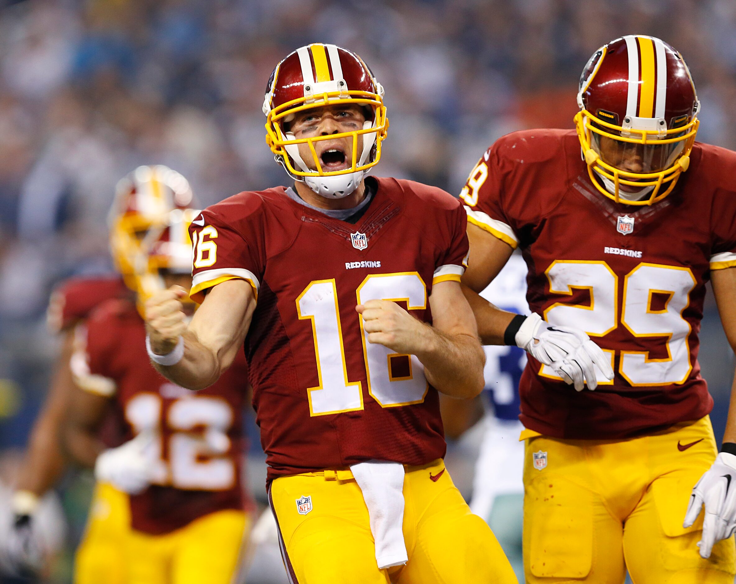 Washington Redskins quarterback Colt McCoy (16) celebrates his fourth quarter touchdown...