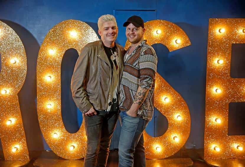 Derek Whitener, left, and his fiancé Victor Brockwell pose for a photograph on stage at The...